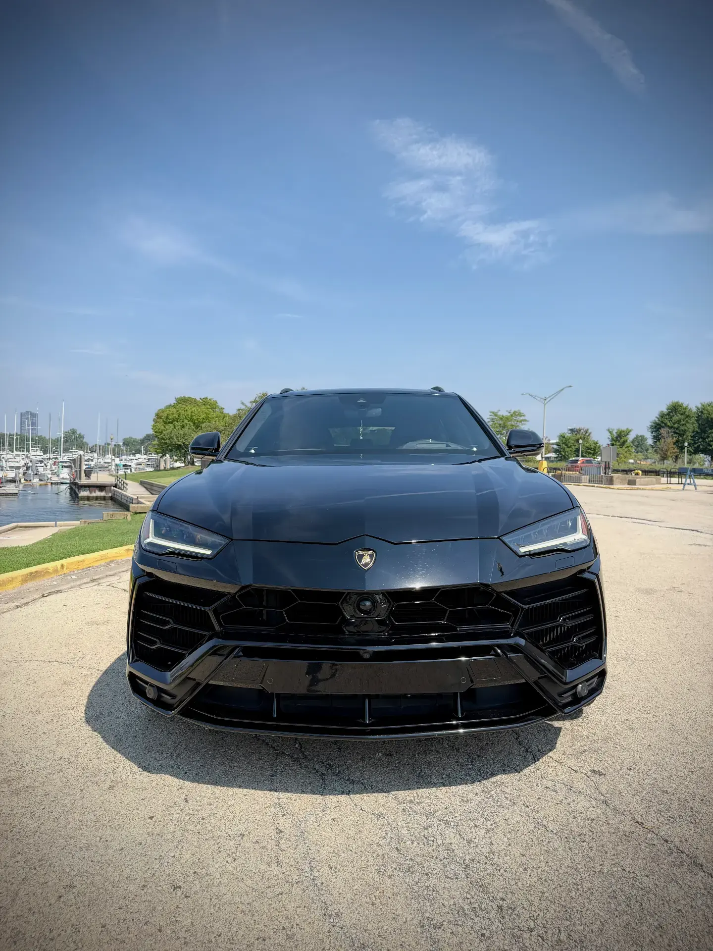 Lamborghini Urus - Black with Red Interior exterior front view — Axel Luxury Chicago
