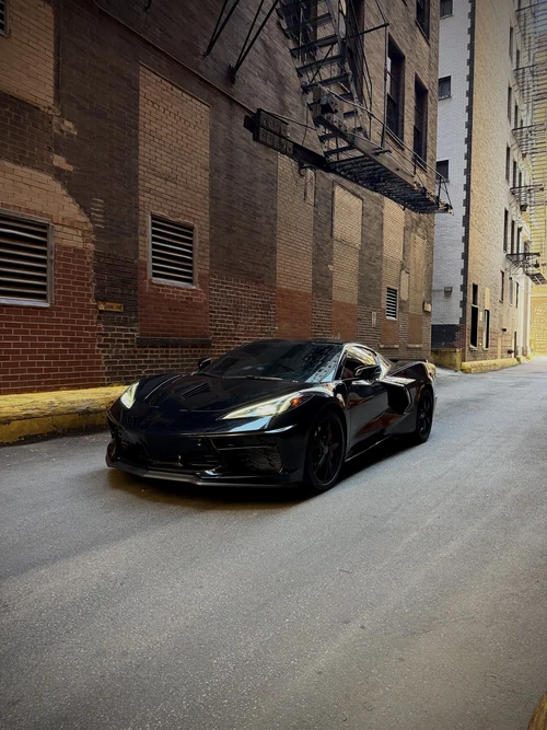 Corvette C8 Stingray - Black exterior front 3/4 view — Axel Luxury Chicago