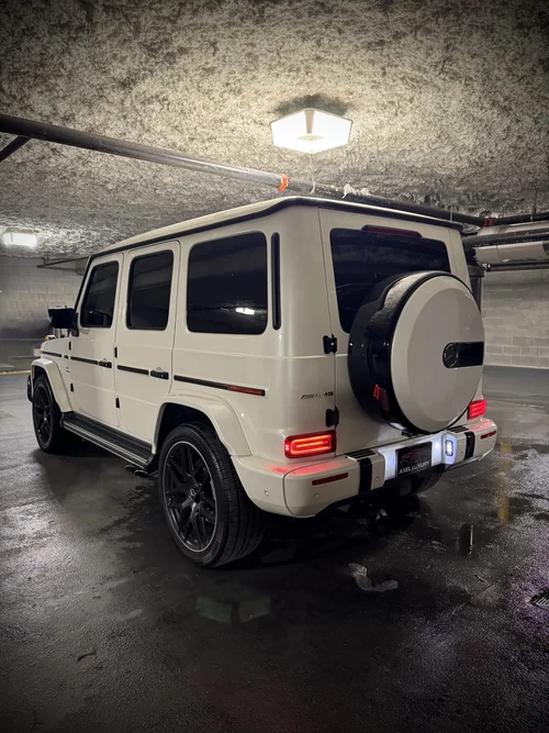 Mercedes-AMG G63 - White exterior side view — Axel Luxury Chicago