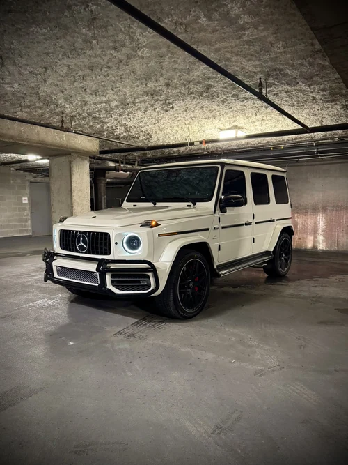 Mercedes-AMG G63 - White exterior front 3/4 view — Axel Luxury Chicago