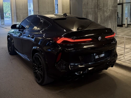 BMW X6M Competition exterior rear view — Axel Luxury Chicago