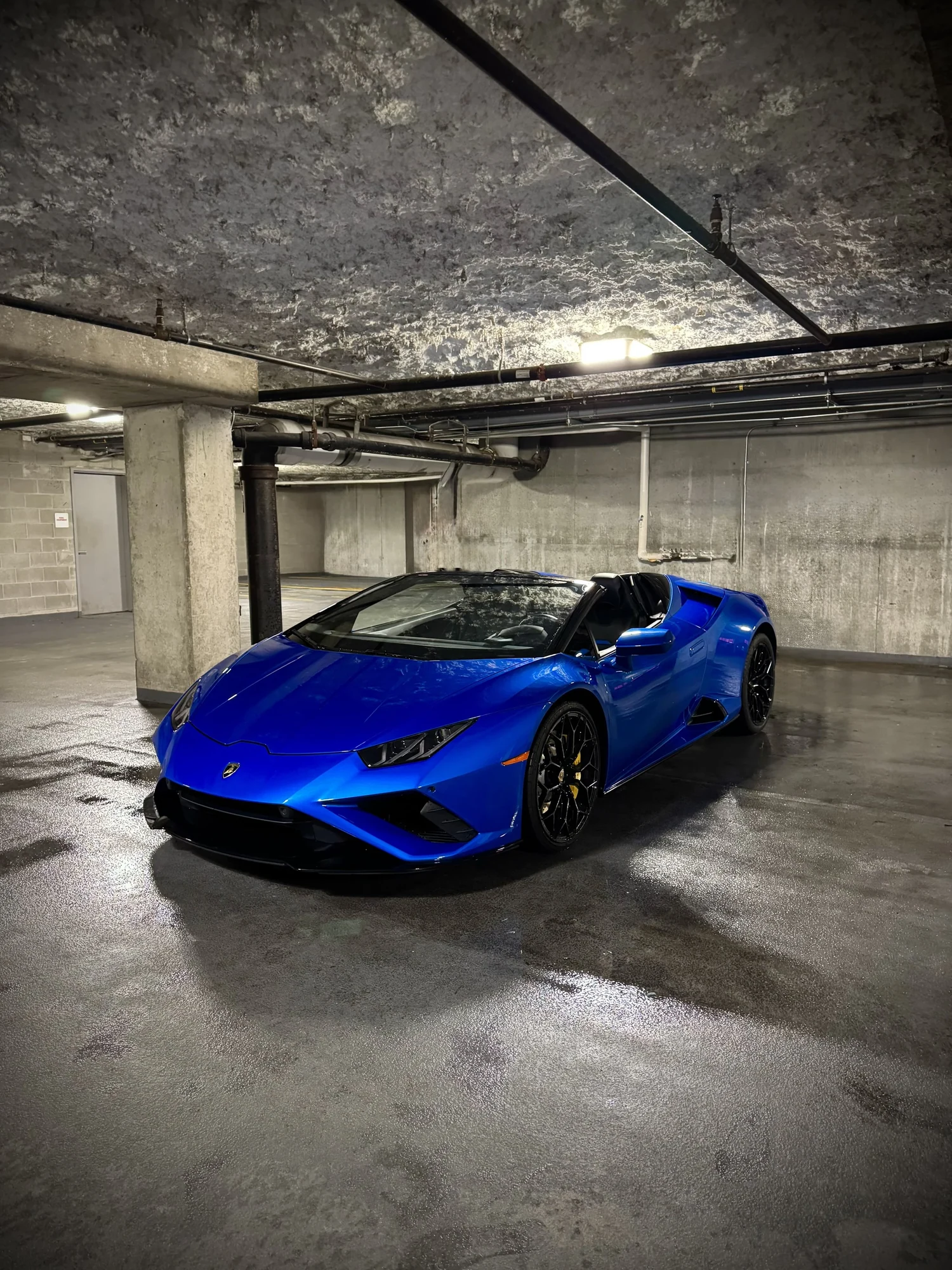 Blue Lamborghini Huracán Evo Spyder available to rent in Chicago from Axel Luxury