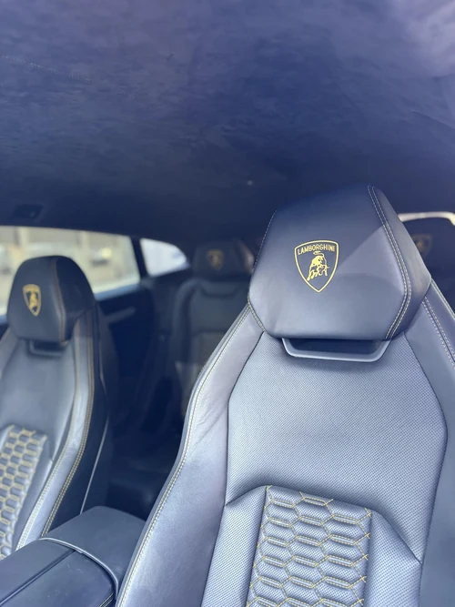 Lamborghini Urus - Black with Yellow Accents photo 4 — Axel Luxury Chicago