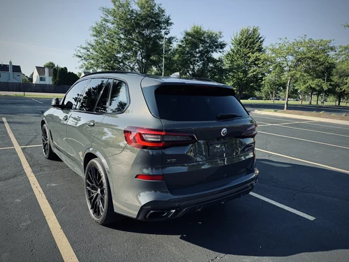 BMW X5 M50i exterior rear view — Axel Luxury Chicago