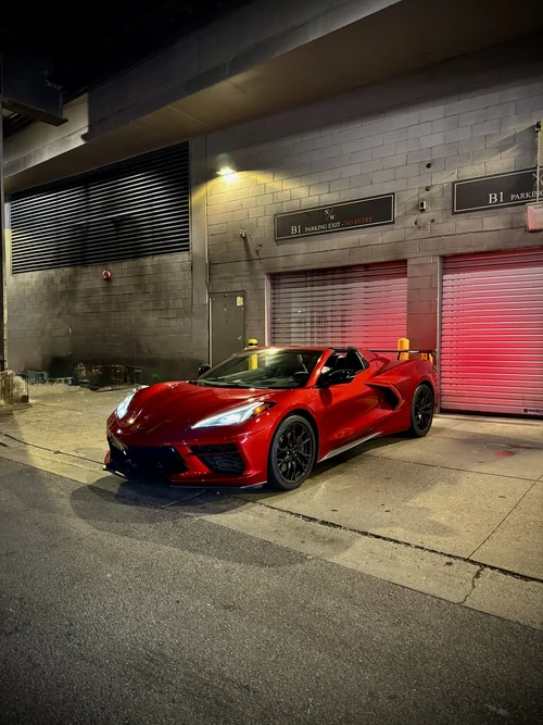 Corvette C8 Stingray - Metallic Red exterior front 3/4 view — Axel Luxury Chicago