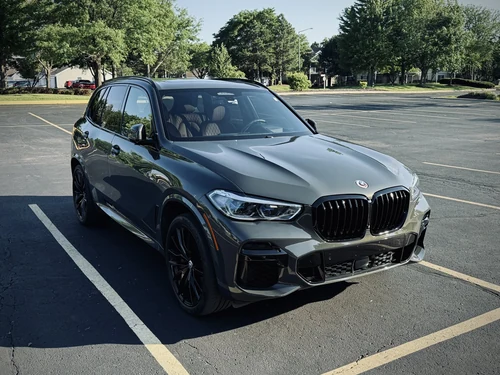 BMW X5 M50i exterior front 3/4 view — Axel Luxury Chicago